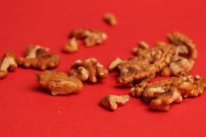 A pile of nuts on a red surface